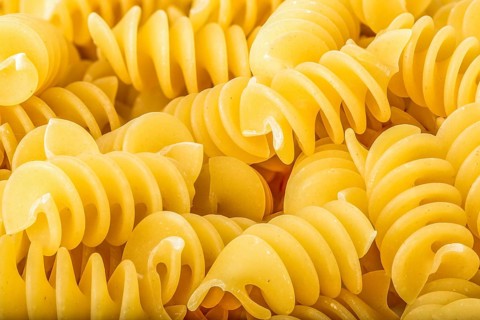 View of raw spiral pasta close up