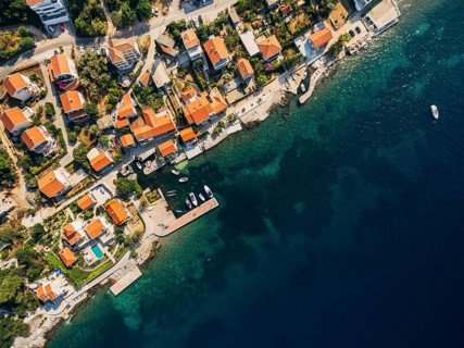Aerial footage from the drone - villas, houses and hotels on the beach in Montenegro, the Adriatic