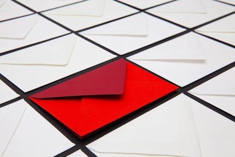 Composition with white and colored envelopes on the table. The photo suitable for various holidays