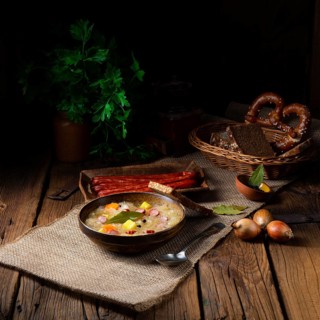 Rustic sauerkraut soup with bacon and sausage