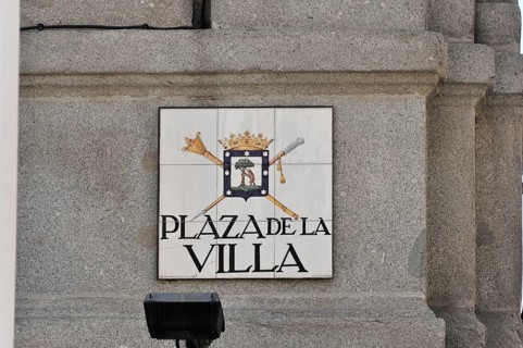 Coat of arms sign on a stone wall with the inscription 'Plaza de la Villa', Madrid, Spain, Europe
