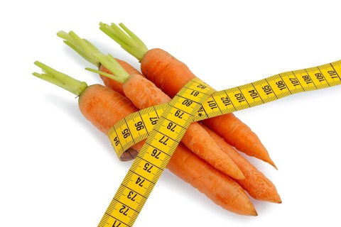 Organically grown carrots with measuring tape Fresh fruit and vegetables are always healthy.