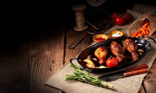 Grilled chicken legs in a barbecue marinade with sweet potatoes