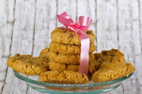 Delicious biscuits on a decorative background