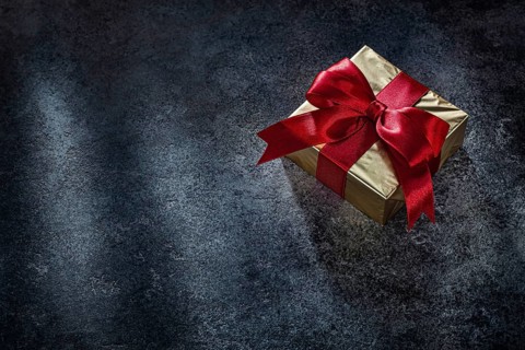 Square Golden Gift Box On Dark Background