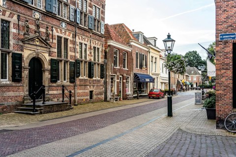 Naarden, Netherlands, August 5, 2016: Picturesque street in Naarden city centre. Naarden was