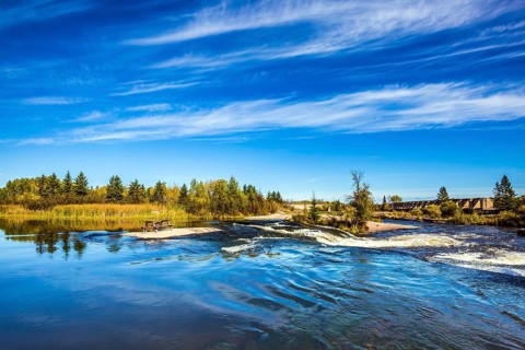 Landscape in the Old Pinawa Dam Park, broad and stormy Winnipeg River. Trend of travel Around the