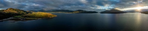 Evening mood at Loch Alsh with Tulach Ard hill and Skye Bridge, drone shot, Reraig, Kyle, Scotland,