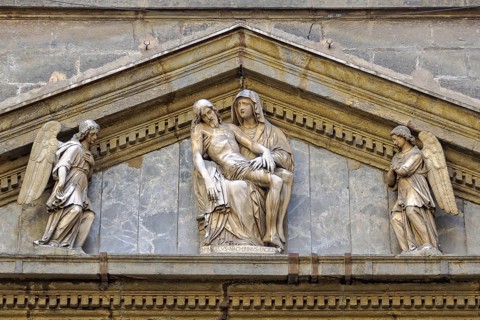 Sculpture of La Pieta by Michelangelo Naccherino in the tympanum above the entrance of the Chapel