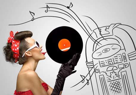 Vintage photo of a retro pinup girl licking retro records with her tongue against the sketchy