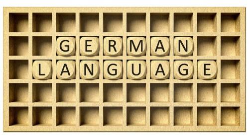 3d rendering of a wooden grid with cubes and the message german language