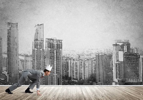 King businessman in elegant suit running and drawn cityscape silhouette at background