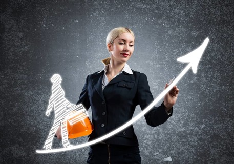 Business lady drawing success graph of professional career. Strategy planning and development of
