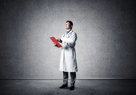 Portrait of the Doctor. Holds a tablet with documents in his hands and makes notes