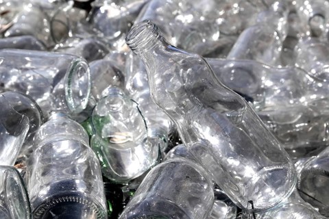 Bottle glass in a recycle bin mound
