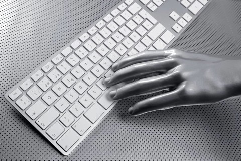 Computer keyboard aluminum gray hand silver background