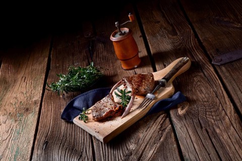 Grilled lamb chops on an old board