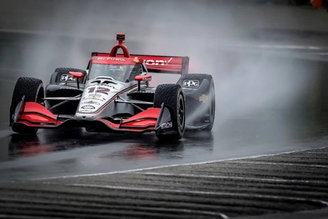 WILL POWER (12) of Toowoomba, Australia comes through turn 12 (Canada Corner) during a wet practice