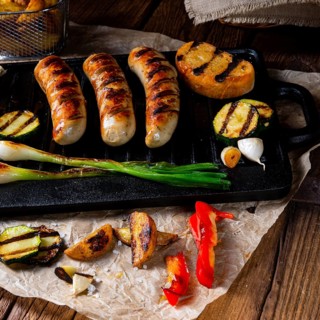Delicious grilled sausage with various grilled vegetables