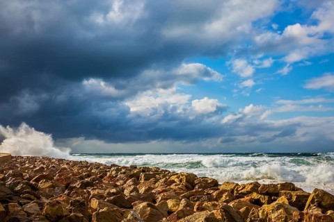 New Quay in the Old Jaffa in a winter storm. Huge foaming waves of the Mediterranean beat against