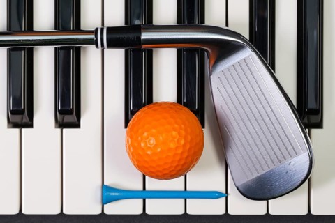 Virtuosic game - Piano keyboard and different golf equipments