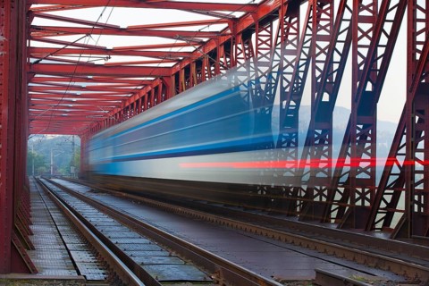 Speed train on the old iron railway bridge, Vsenory, Czech Republic, Europe