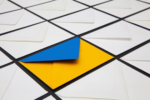 Composition with white and colored envelopes on the table. The photo suitable for various holidays