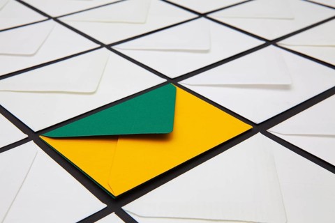 Composition with white and colored envelopes on the table. The photo suitable for various holidays