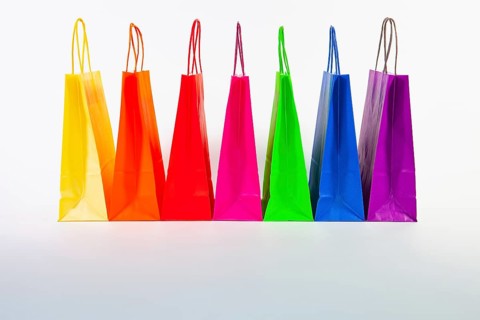 Set of colorful empty shopping bags isolated on the white background. Sale, consumerism,