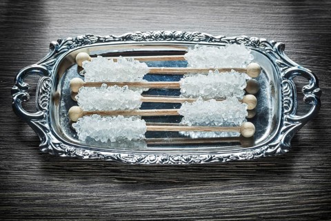 Sweet sugar sticks on metallic tray
