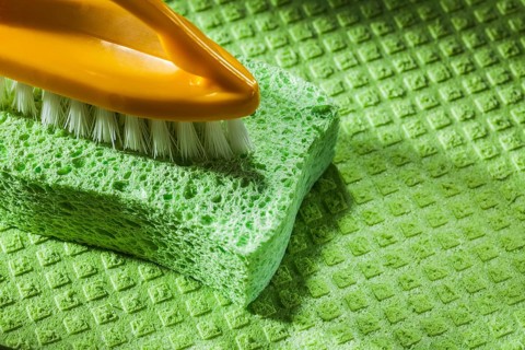 New plastic brush kitchen sponge on dishcloth