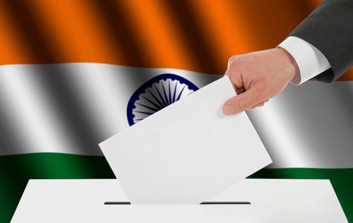 The Indian flag and the hand with the bulletin about the ballot box