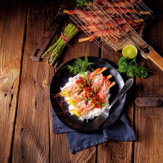 Grilled red argentine shrimps with red salsa and green asparagus