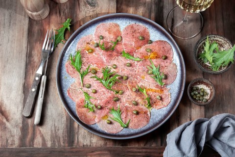 Food, Food, Marbled beef carpaccio with arugula and capers on gray plate with white wine, wooden