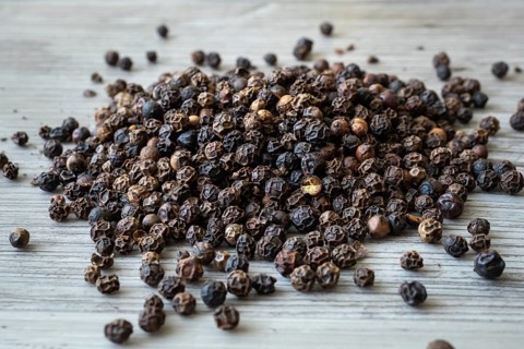 Peppercorns from a black pepper plant (Piper nigrum)