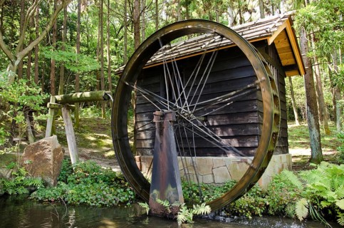 Small Japanese water mill running in the Expo Commemorative Park, Osaka, Osaka, Japan, Asia