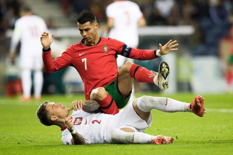 Football match, captain Cristiano RONALDO CR7 Portugal on the stomach of Kamil PIATKOWSKI Poland