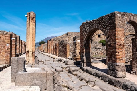 POMPEII, ITALY, MAY 04, 2022, A crosswalk of a typical Roman road in the ancient city of Pompeii,