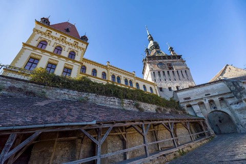 Gateway with tower clock in Sighisoara, Romania, Europe