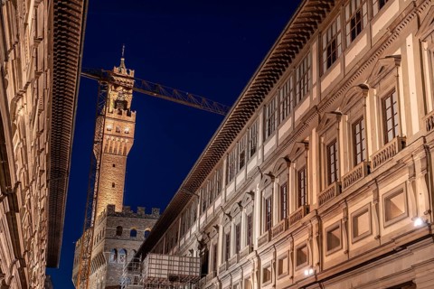 The famous Uffizi and the tower of the Palazzo Vecchio of Florence illuminated at night, Italy,