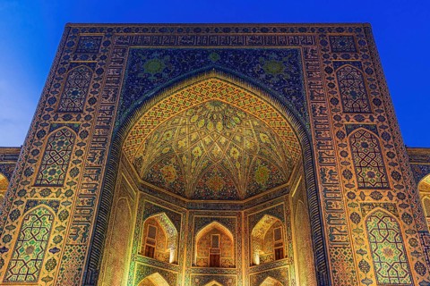 Tilya-Kori Madrasah with lights on Registan square