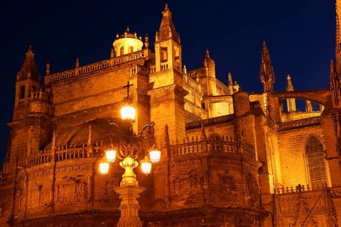 Detail of the gothic and baroque Cathedral of Seville in Spain by night