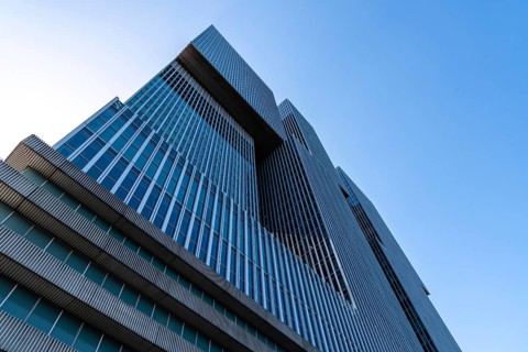 Rotterdam, Netherlands, May 8, 2022: De Rotterdam Skyscraper against sky. Designed by Rem Koolhaas