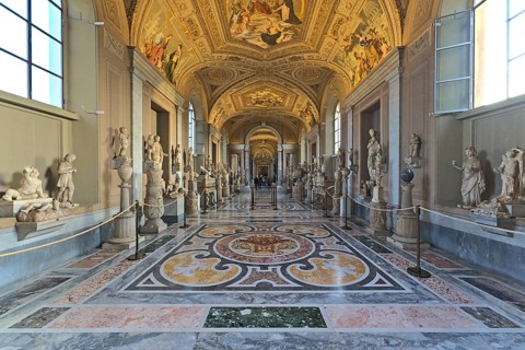 Inside of the Vaticans museums in one of the long hallways with few visitors