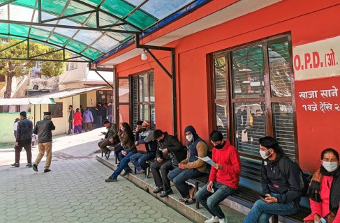 Kathmandu, Nepal, 16 March 2020: People wearing protecting masks outside a hospital, waiting for