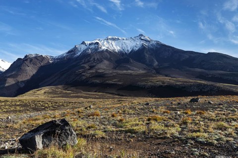 Beautiful volcanic landscape of Kamchatka Region: autumn view of Kozelsky Volcano on background of