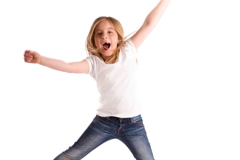Blond kid girl indented jumping high wind on hair denim jeans at white background
