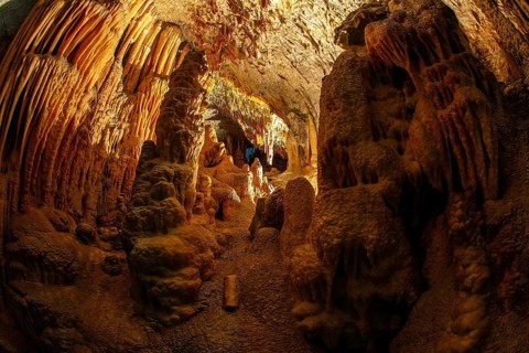 Colossal system of underground caves in Slovenia. Postojna Cave. Fantastically lit underground