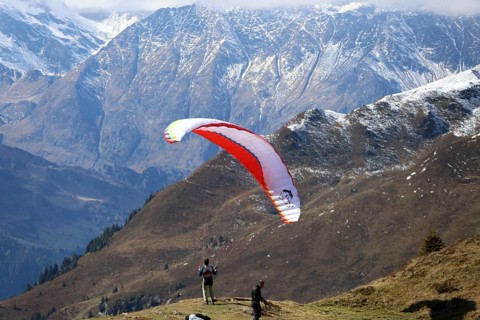 A paraglider takes off in the hiking paradise and holiday region of South Tyrol / Alto Adige on the