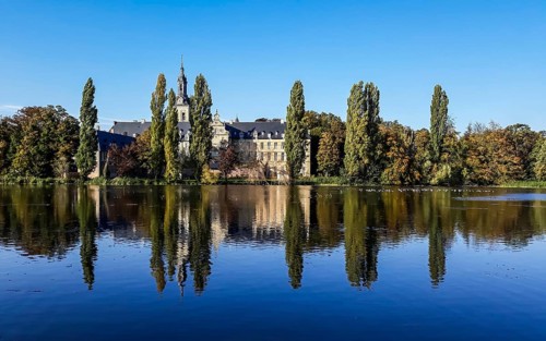 The Abbey of the Park reflecting in the pond in Leuven, Belgium, Europe